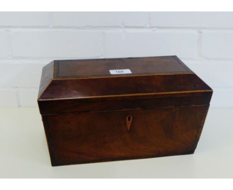 A mahogany sarcophagus tea caddy, the hinged lid opening to reveal three divisions with lion ring mask handles, 31 x 18cm 