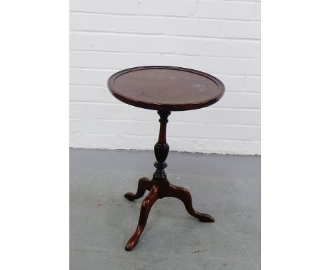 A mahogany wine table, the circular dished top on tripod support,  52 x 36cm