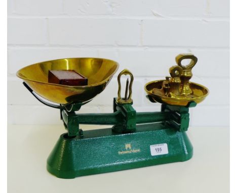 A Fortnum & Mason green painted set of brass scales together with various weights (a lot) 