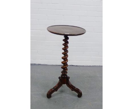 A mahogany occasional table, the circular dished top on a spiral twist column and tripod supports, 73 x 31cm