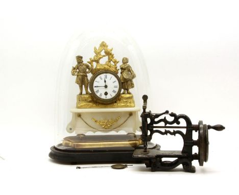 An onyx and gilt brass mantel clock, the white enamel face having black Roman numerals under glass dome, together with a smal