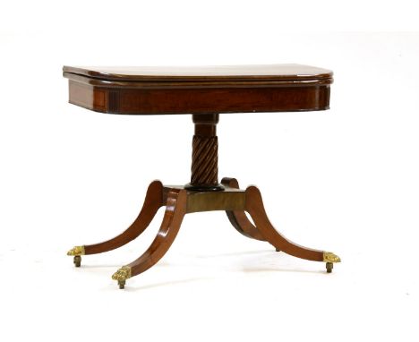 A George III inlaid mahogany fold over card table, the shaped top over a plain frieze, on a spirally reeded support on four s