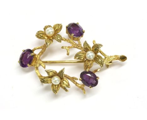 A 9ct gold amethyst and cultured pearl spray circle brooch, by Cropp and Farr, a circular branch with flower heads, each set 