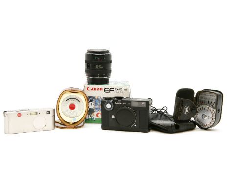 A Leica CL camera no. 1312342, a Leica D-LUX compact camera no. 2893623, a Canon EF 35-70mm f/35-4.5 lens, and two light mete
