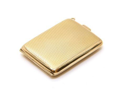 A 9ct gold vesta case, of rectangular form and with engine turned decoration, marks for Birmingham, and stamped Raymond Keith