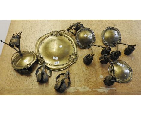 An Art Nouveau brass three light ceiling light, of stylised flowerhead form, together with a set of four matching twin light 
