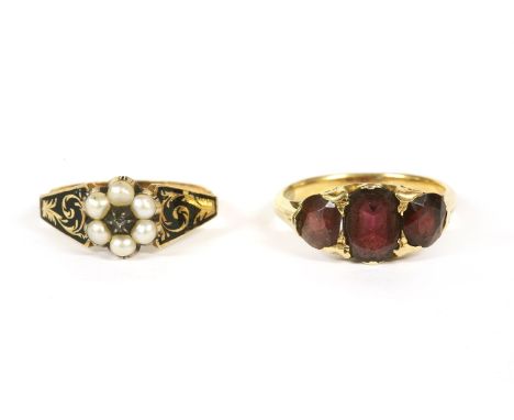 A gold three stone garnet ring, (tested as 14ct gold), 3.98g, a Georgian memorial diamond and split pearl cluster ring, with 