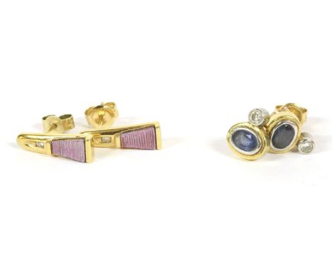 A pair of 18ct gold diamond and sapphire stud earrings, a rub set diamond to an oval cut sapphire in a yellow collet, 2.33g, 