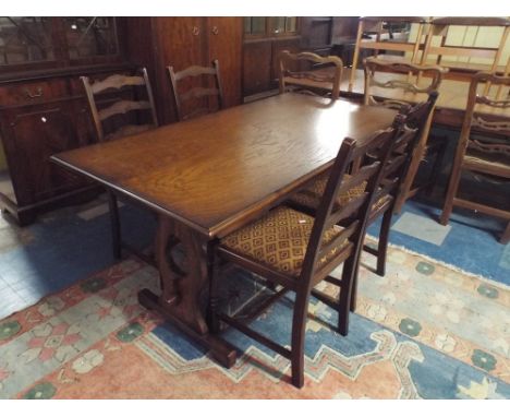 An Oak Refractory Dining Table and Four Ladder Back Chairs 