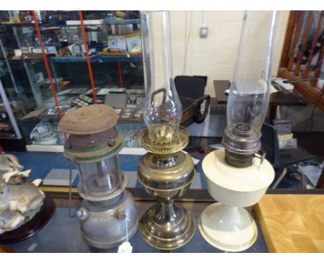 A Brass Oil Lamp, Enamel Lamps and Hurricane Lamp 