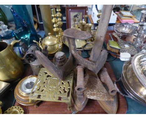 A Tray Containing Four Flat Irons, Shoe Last, Brass Tea Pot Stand, Vintage Adze etc