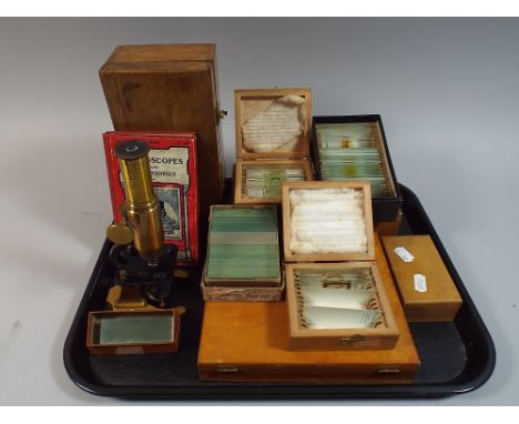 A Vintage Brass Mounted Microscope with Slides and Instruction Book