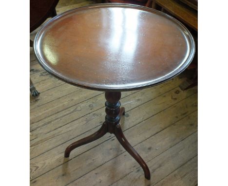 A 19th Century Mahogany circular snap top table on turned column and tripod legs