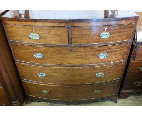 A 19th Century Mahogany and cross banded bow front chest of three long and two short drawers on bracket feet