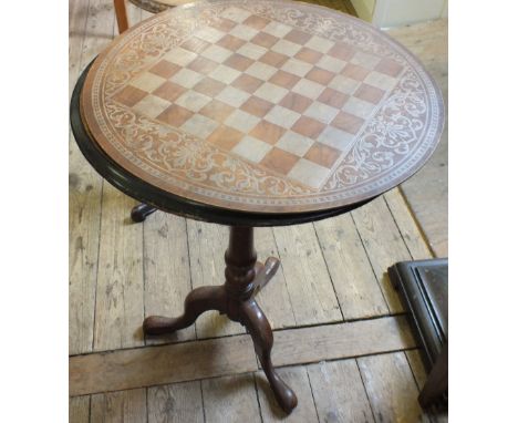 A Victorian Walnut and Mahogany circular tripod table with ebonised and floral inlaid top, twist column and replacement chess