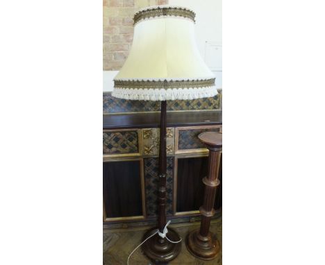 A Mahogany torchere and a standard lamp