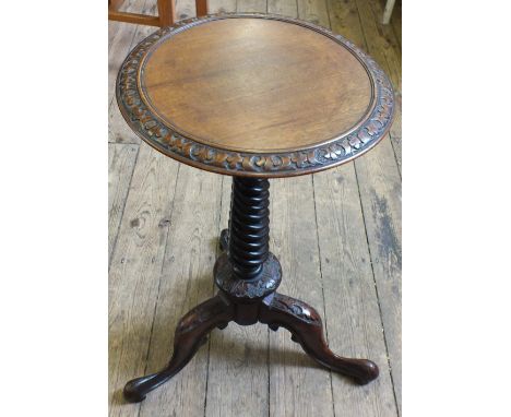 A Victorian carved Mahogany wine table on twist column and tripod support