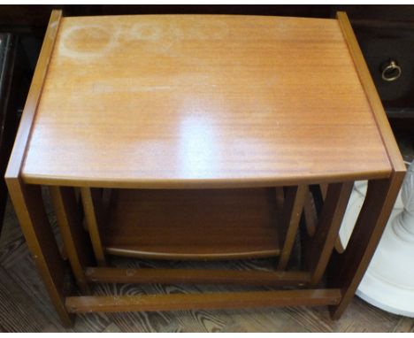 A white painted standard lamp and a nest of three Teak tables