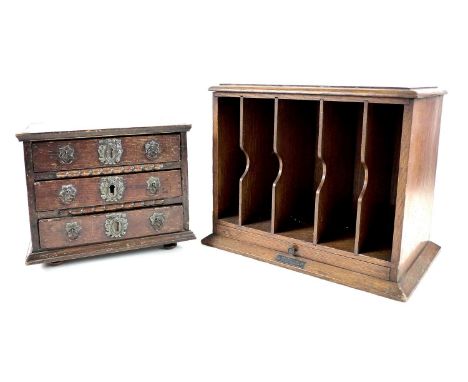 An Edwardian oak desk tidy, with five division letter rack above a sliding pen and paper tray, and applied metal plaque 'Tele