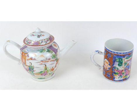 A Chinese porcelain famille rose teapot, with strapwork handle, decorated with two reserve panels depicting exterior scenes w