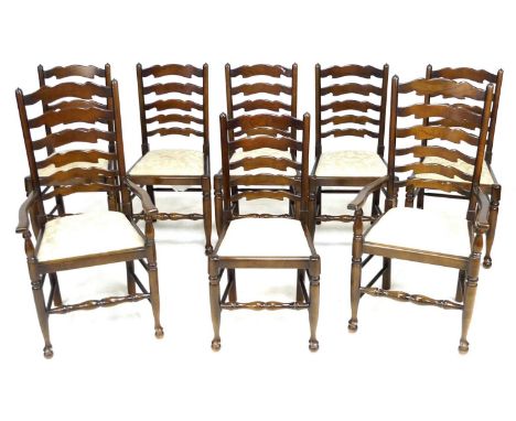 A set of eight 18th century style country ladder back dining chairs, late 20th century, including two carvers, with cream uph