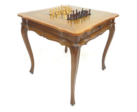 A late 20th century chess board and set on stand, with Staunton style pieces, the the stand with single drawer, 77 by 77 by 7