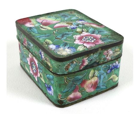 A Chinese enamel box and cover, of rectangular section with rounded corners, decorated with sprays of flowers against a green