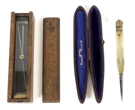 A WWI trough compass with sliding lid, jewelled brass bearing, 16.5 by 4 by 3cm high, together with a pair of brass architect