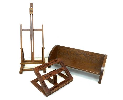 A vintage folding table easel, 83 by 28.5 by 9.5cm high, an oak table top bookshelf, 62 by 25 by 23cm high, and a carved adju