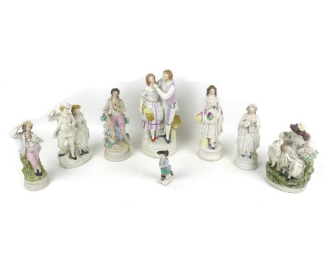 A group of eight bisque and ceramic figurines, including a 19th century Royal Berlin (KPM) factory porcelain figure, modelled