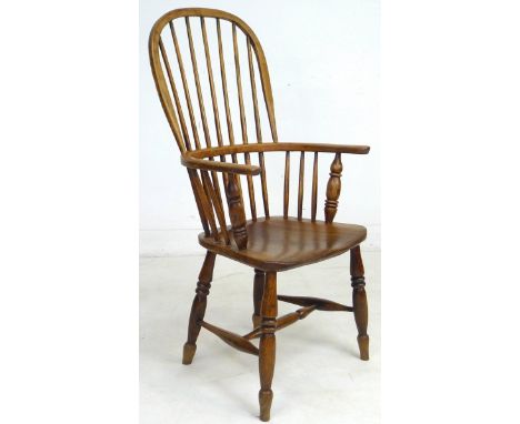 A 19th century oak Windsor chair, high rounded back with stick supports, H stretcher, turned legs, 53 by 55 by 107cm high. 