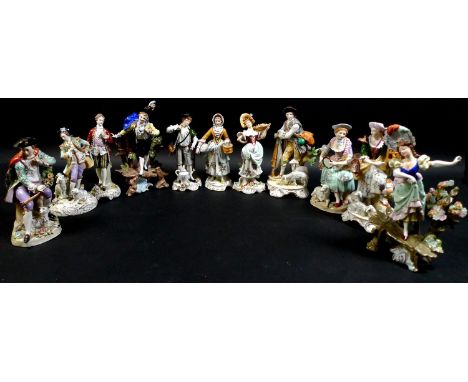 A group of eleven Sitzendorf porcelain figures, all in 18th century style and costume, comprising a pair of figures, model nu