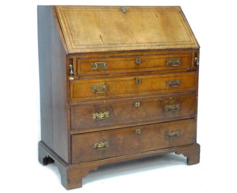 A George III mahogany bureau, inlaid decoration, fall front with fitted interior over four graduating drawers, with cock bead