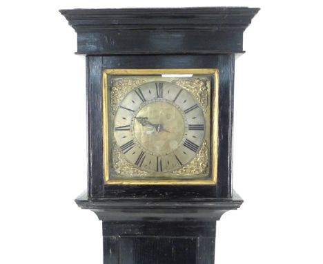 An early 18th century oak cottage longcase clock, the 9" square brass dial signed 'Nichols, Oundle', single steel hand over a