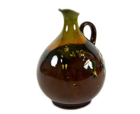 An Edwardian Royal Doulton Kingsware jug, with ovoid body and slender neck and spout, applied scrolled handle, decorated with