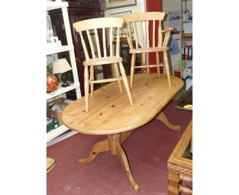 Oval pine twin pedestal dining table and six beech chairs