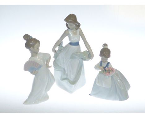 Collection of three Nao girl figures