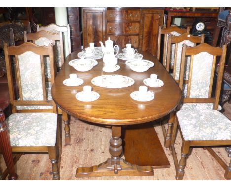 Old Charm oval extending dining table and leaf together with six tapestry panel back dining chairs (4x2)