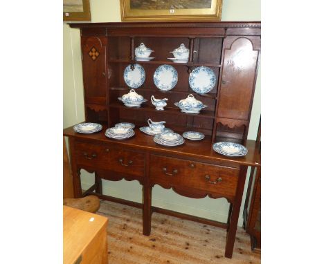 Arts & Crafts style oak shelf and cupboard back two drawer dresser