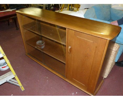 Elm sliding glazed door bookcase probably Ercol