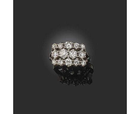 A diamond ring, set with three rows of circular-cut and brilliant-cut diamonds totalling approximately 1.60 carats, mounted i