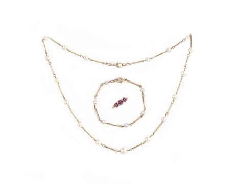 A cultured pearl demi-parure and a ruby and diamond ring, comprising: a necklace and bracelet composed of elongated gold wire