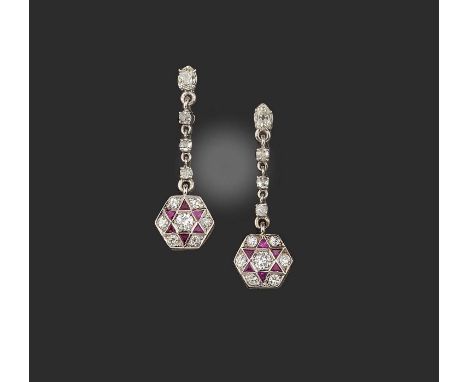 A pair of ruby and diamond earrings, each of pendent design, set with circular-cut and pear-shaped diamonds, suspending a hex