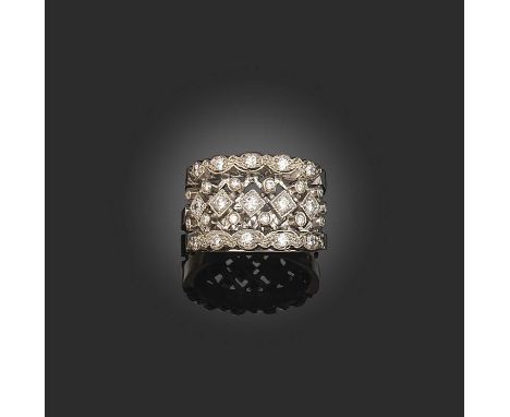 A diamond half hoop ring, of pierced design set with graduated circular-cut diamonds in white gold, 10g, size M