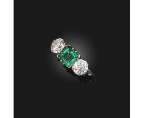 An emerald and diamond ring, early 20th century, set with a step-cut emerald weighing approximately 1.05 carats, between circ