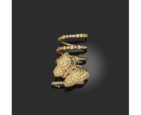A yellow sapphire and diamond ring, designed as a butterfly, pavé-set with circular-cut yellow sapphires and brilliant-cut di