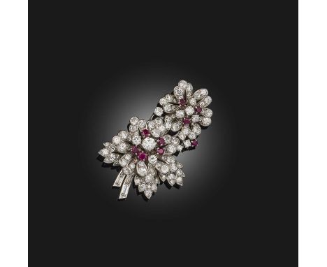 A ruby and diamond brooch, mid 20th century, designed as a sprig of flowers, set with brilliant-cut diamond and circular-cut 