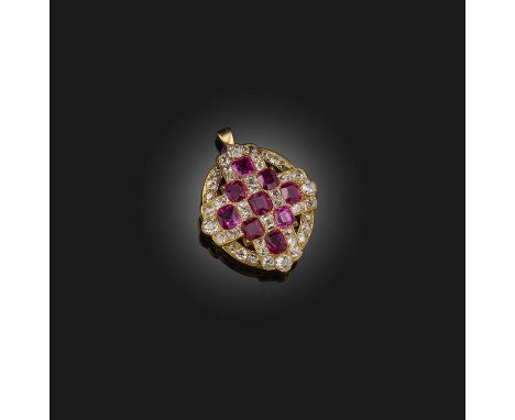 A Victorian ruby and diamond pendant, mid 19th century, designed as a cross in an oval frame, set with cushion-shaped rubies 