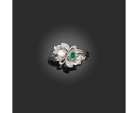 Birks, and emerald and diamond crossover ring, set with a circular-cut emerald and diamond in foliate white gold scroll mount