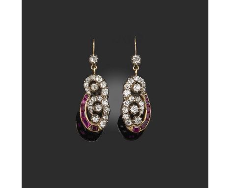 A pair of ruby and diamond earrings, early 20th century composite, each designed as a scroll motif set with circular-cut diam
